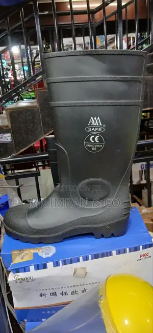 Black Pair Of Safety Gumboots With A Steel Toe Cap And A Pvc Upper.