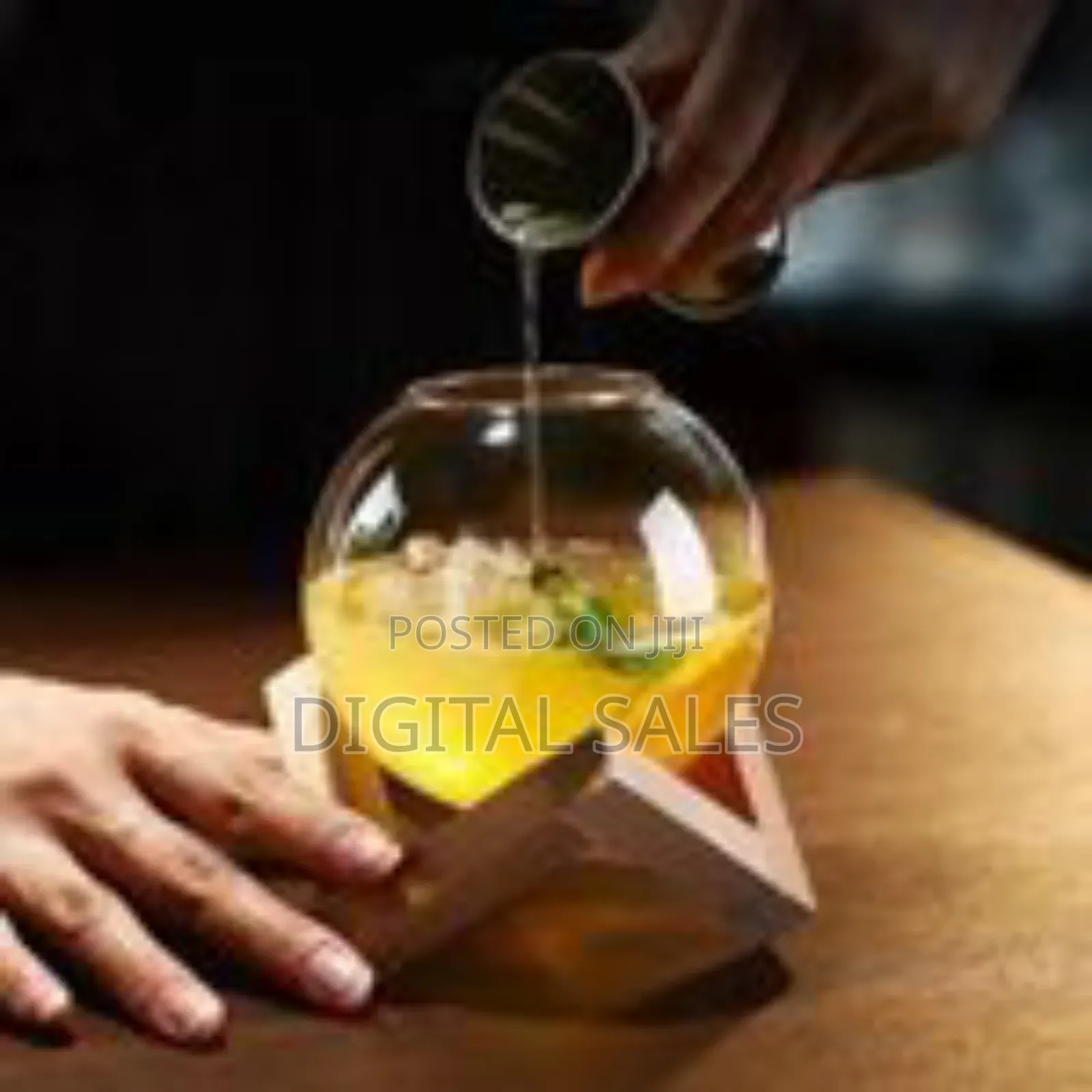 Modern Spherical Glass Beverage Vessel With Geometric Wooden Stand