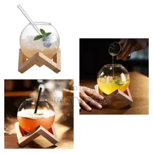 Modern Spherical Glass Beverage Vessel With Geometric Wooden Stand