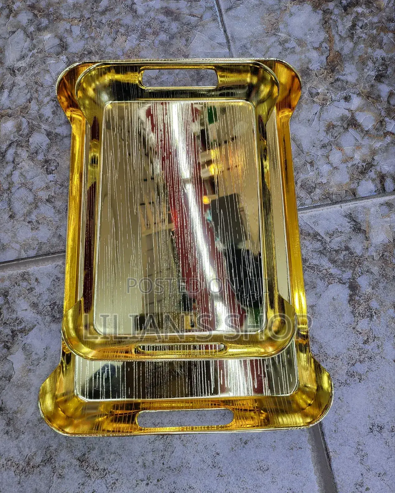 Gold-Toned Metal Serving Trays.