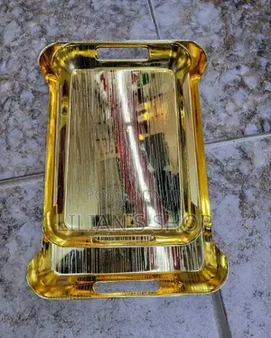 Gold-Toned Metal Serving Trays.