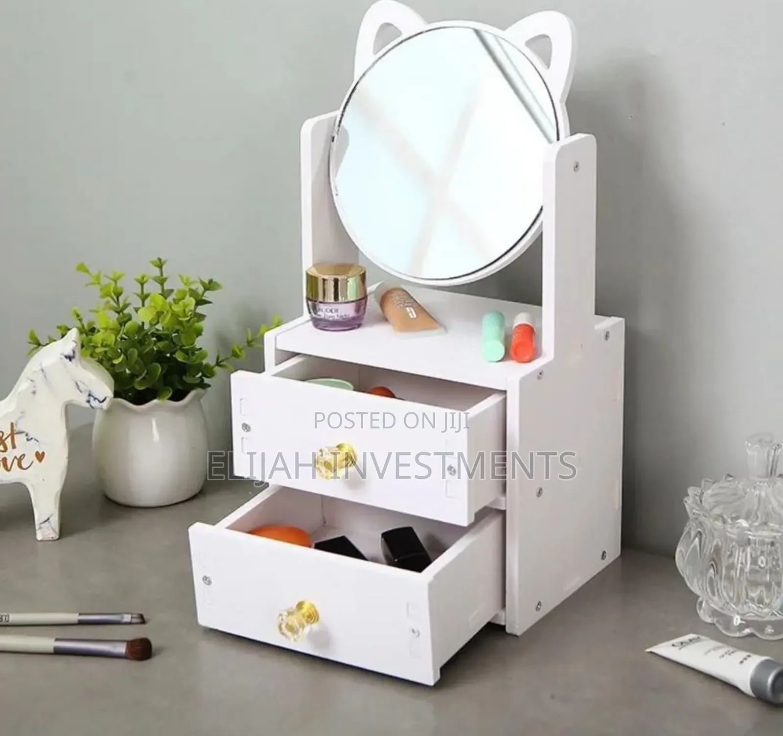 Cosmetic Organizer With a Rotating Mirror and Two Drawers.