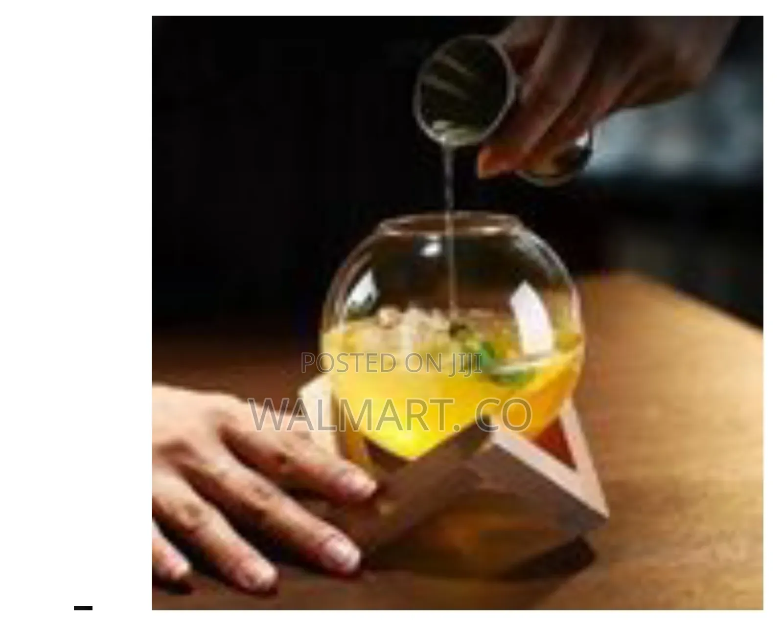 Modern Spherical Glass Beverage Vessel With Geometric Wooden Stand