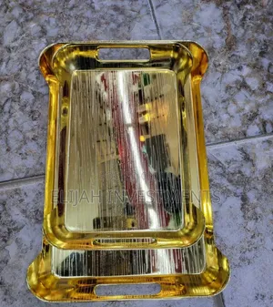 Gold-Toned Metal Serving Trays.