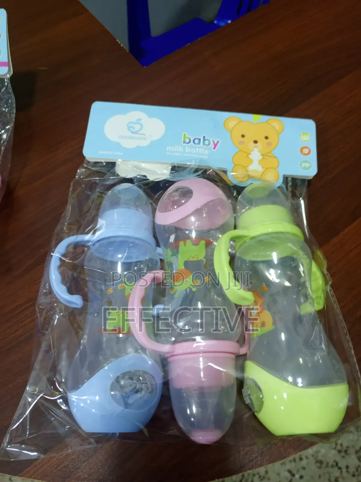 Set of Three Plastic Baby Feeding Bottles.