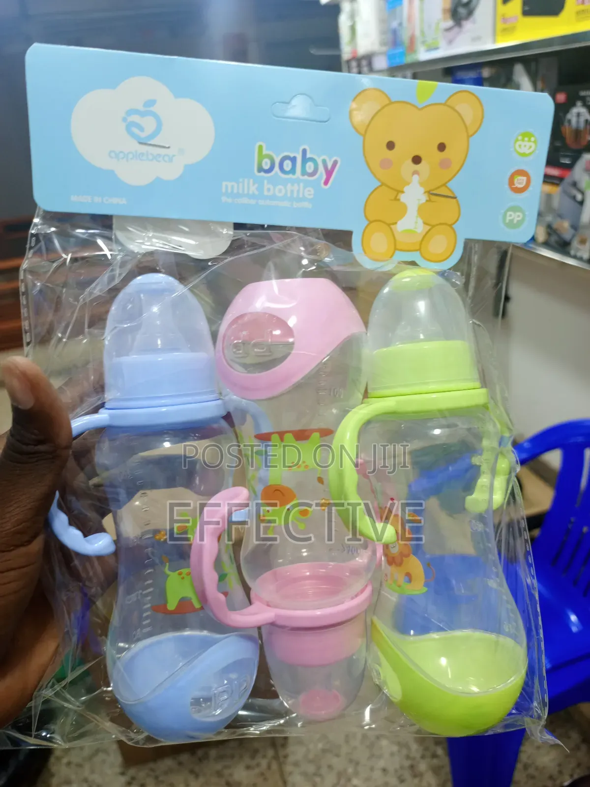 Set of Three Plastic Baby Feeding Bottles.