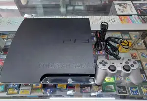 Clean Playstation 3. Ps3 Slim Comes With 13 Games and 2 Controllers