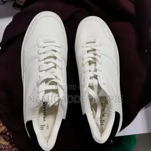 White Low Top Black Heel Sneakers.