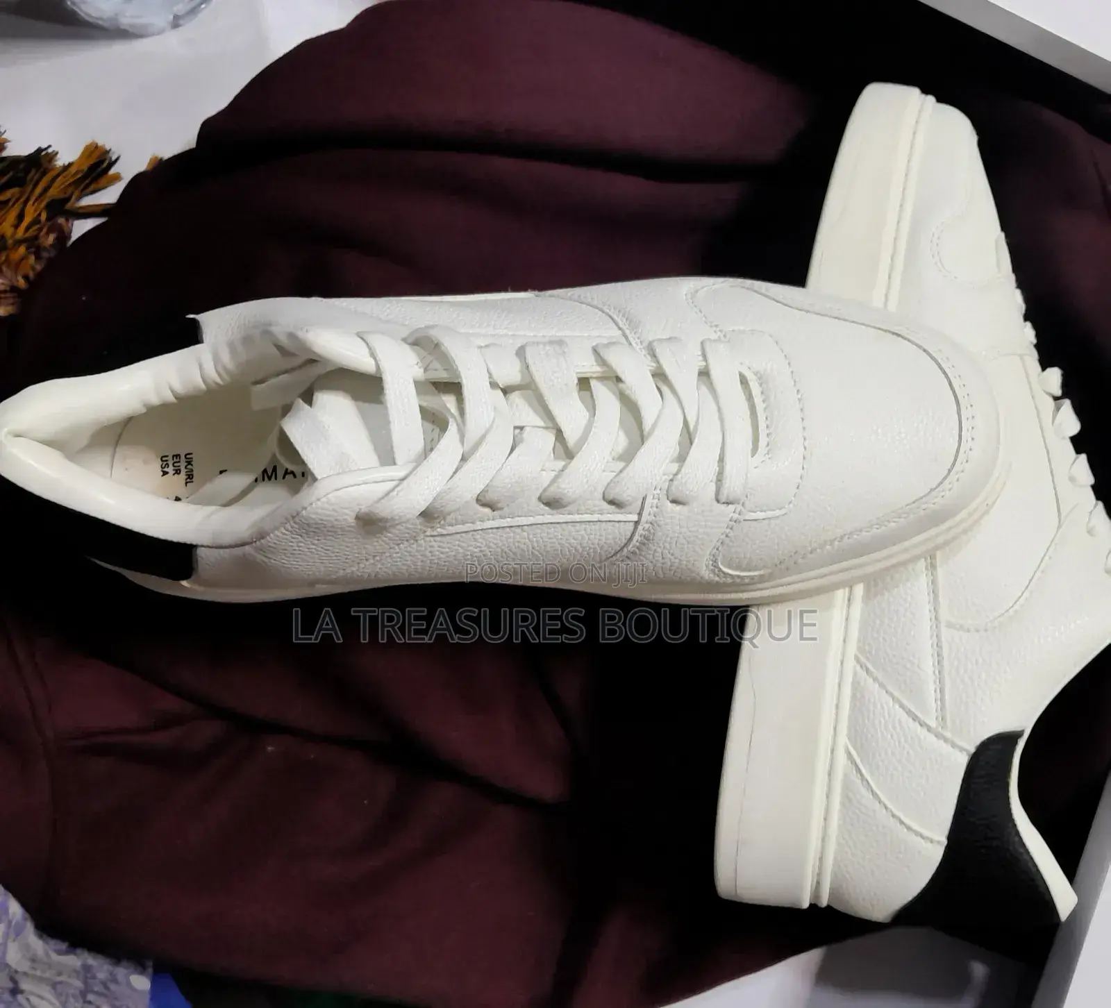 White Low Top Black Heel Sneakers.