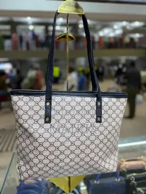 Leather Tote Bag With Durable Shoulder Straps.