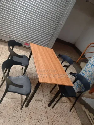 Wooden and Mental Legs Table and Plastic Chairs