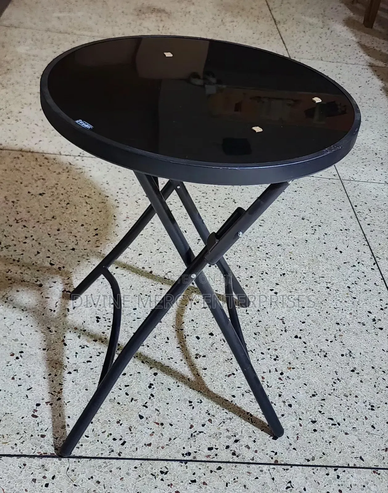 Round Folding Table With a Glass