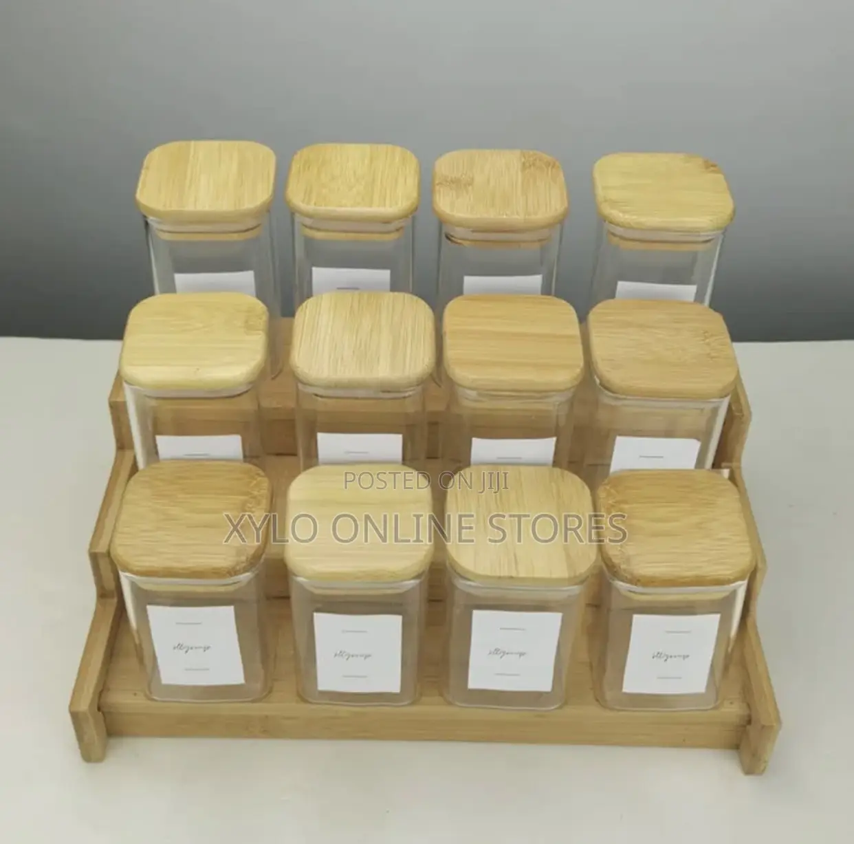 A Set of 12 Piece Square Glass Spice Jar With a Bamboo Rack