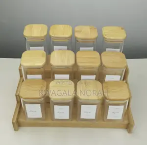 A Set of 12 Piece Square Glass Spice Jar With a Bamboo Rack