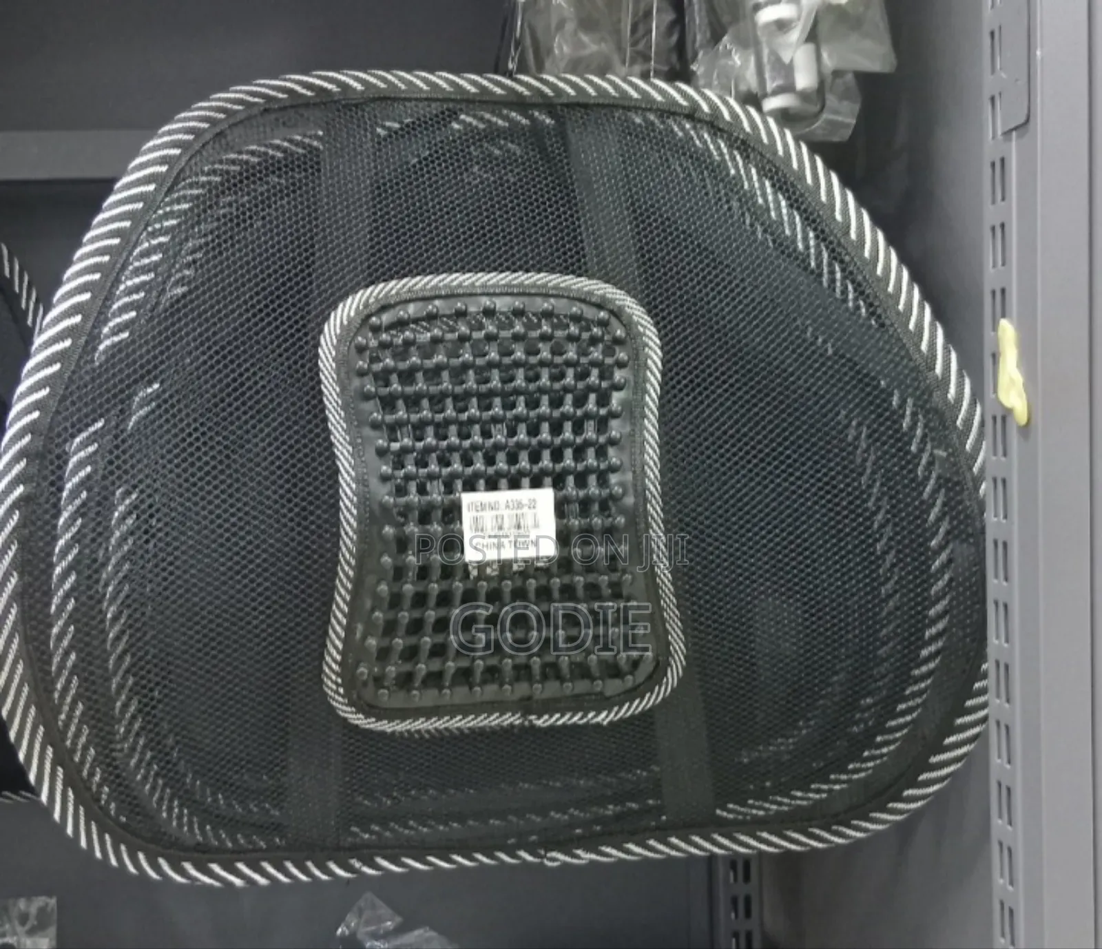 Mesh Car Seat Back Support Cushion With A Lumbar Massage Feature.