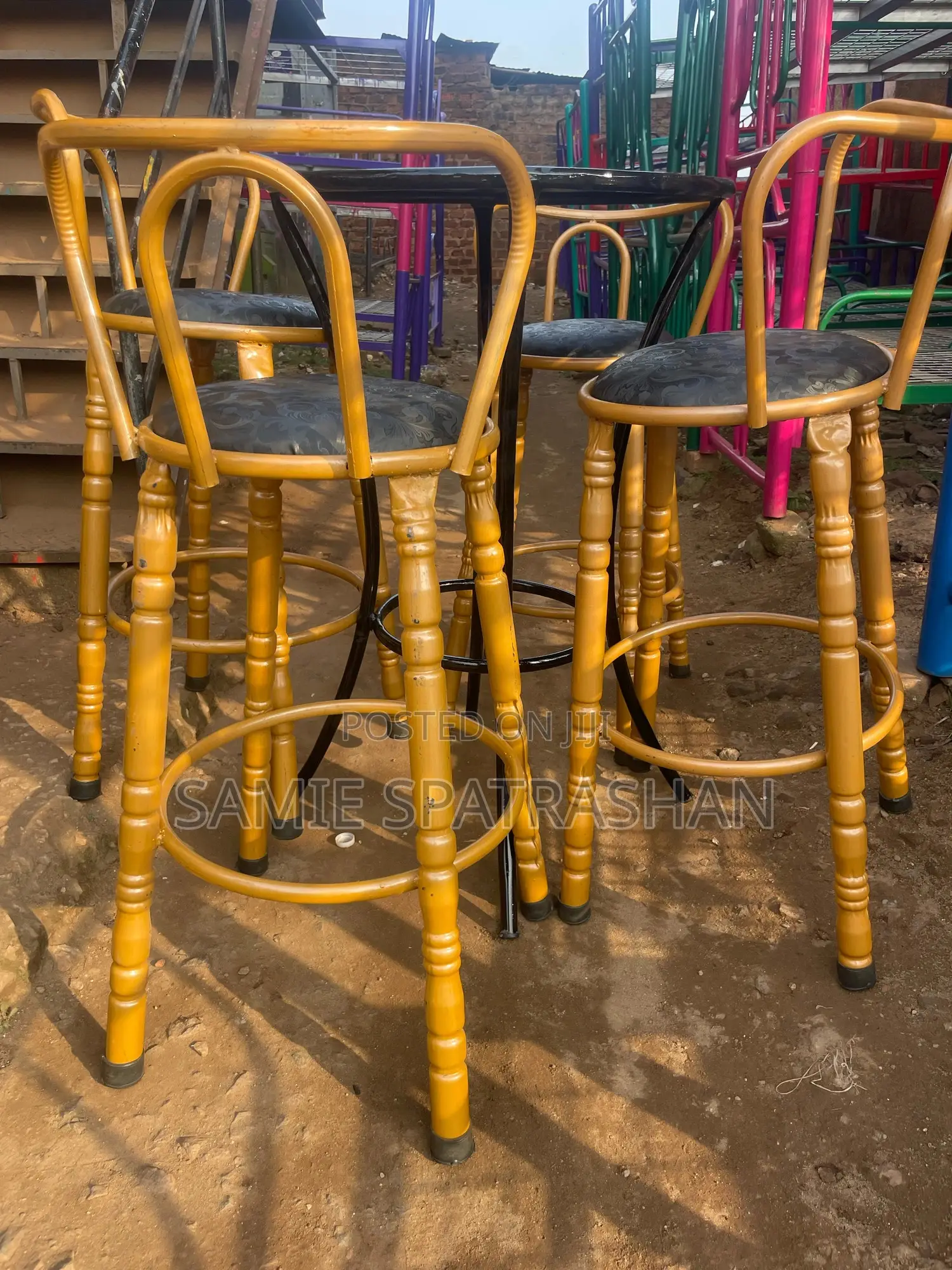A Set of Bar Stools and Chair