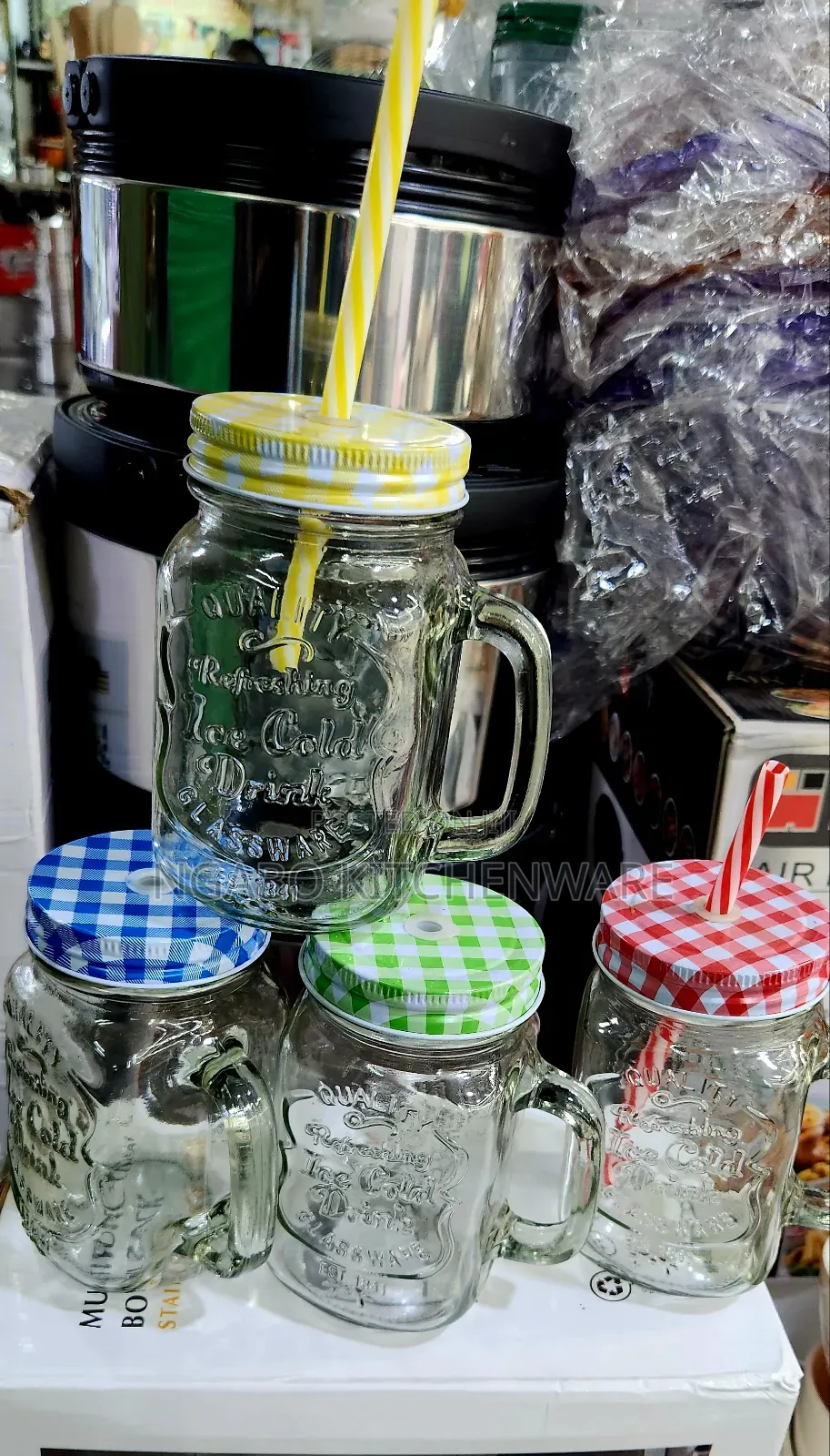 Glass Mason Jar Mugs Equipped With Handles, Lids, and Straws