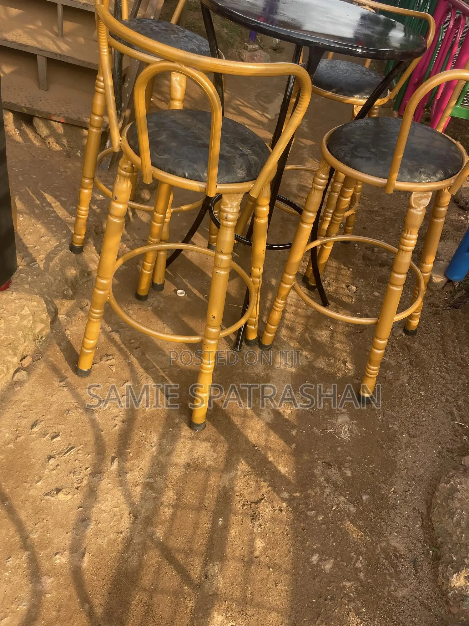 A Set of Bar Stools and Chair