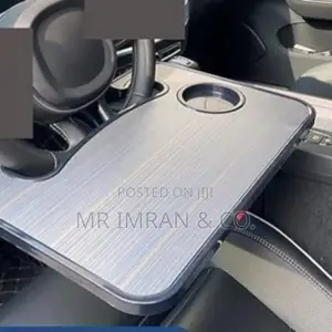 Portable Desk or Table Within a Vehicle Steering Wheel Tray.