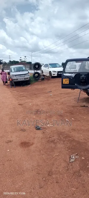 Acre on Sale Touching Road Near Express Roundabout Entebbe