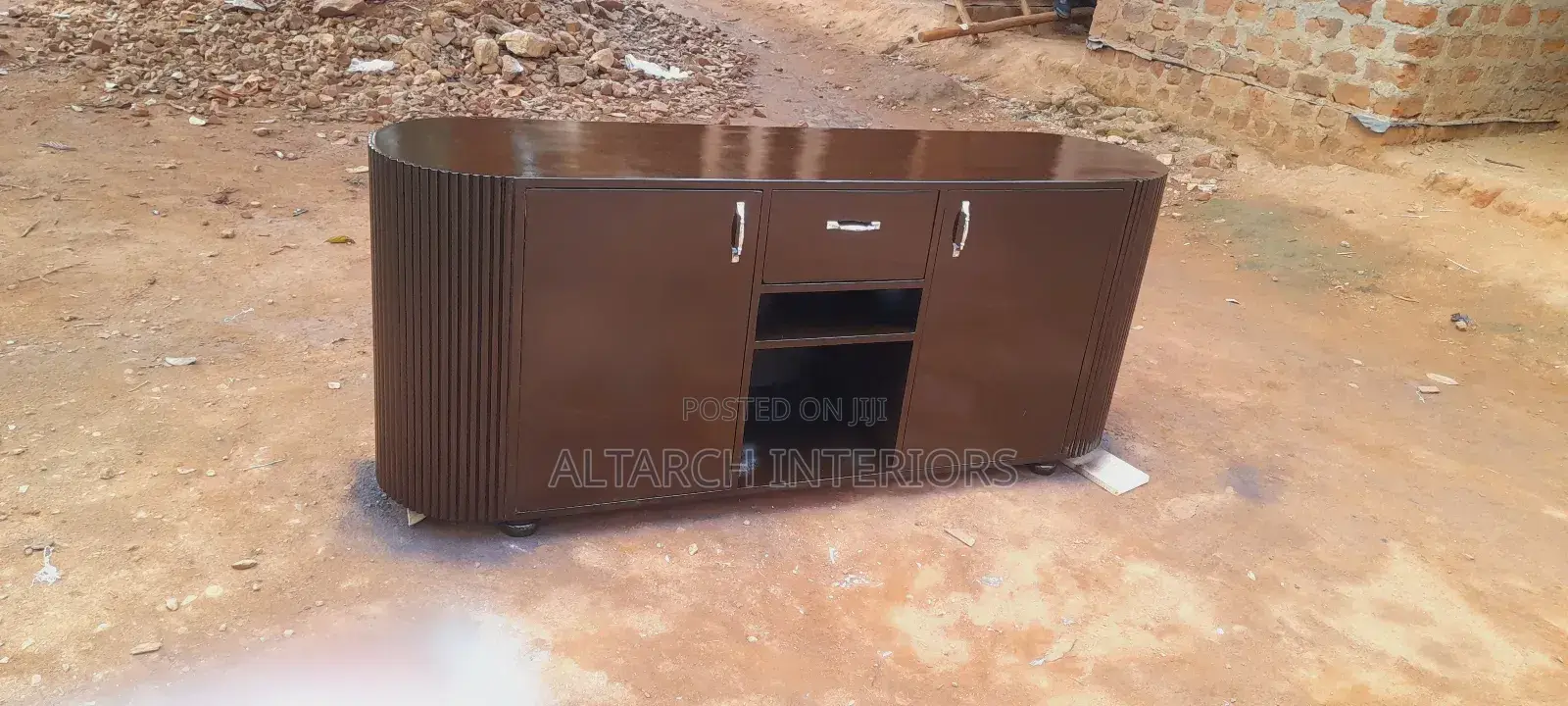 Well Finished Curved Tv Stand in Coffee Brown With 2 Shatters 1drawer