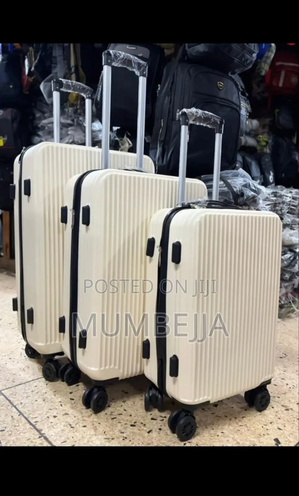 Cream Colored Hard Shell Trolley Suit Case.