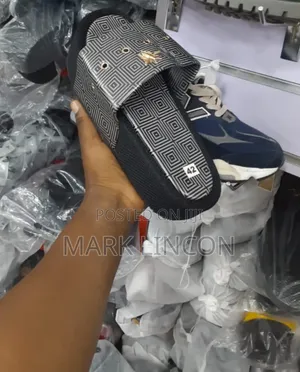 Luxury Slide Slippers With a Gold- Tone Metallic Emblem