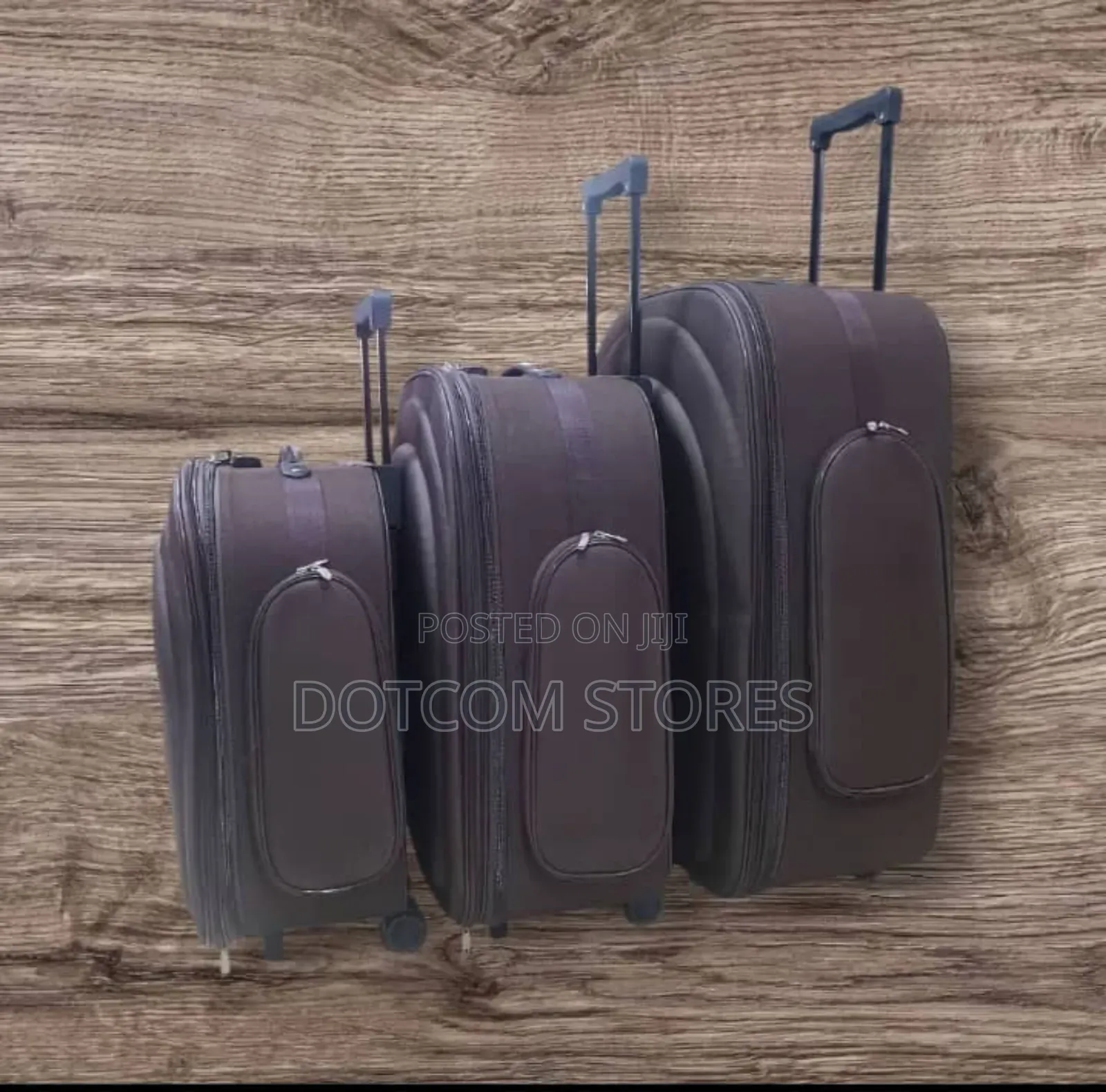 Three Brown Fabric Trolley Suitcases