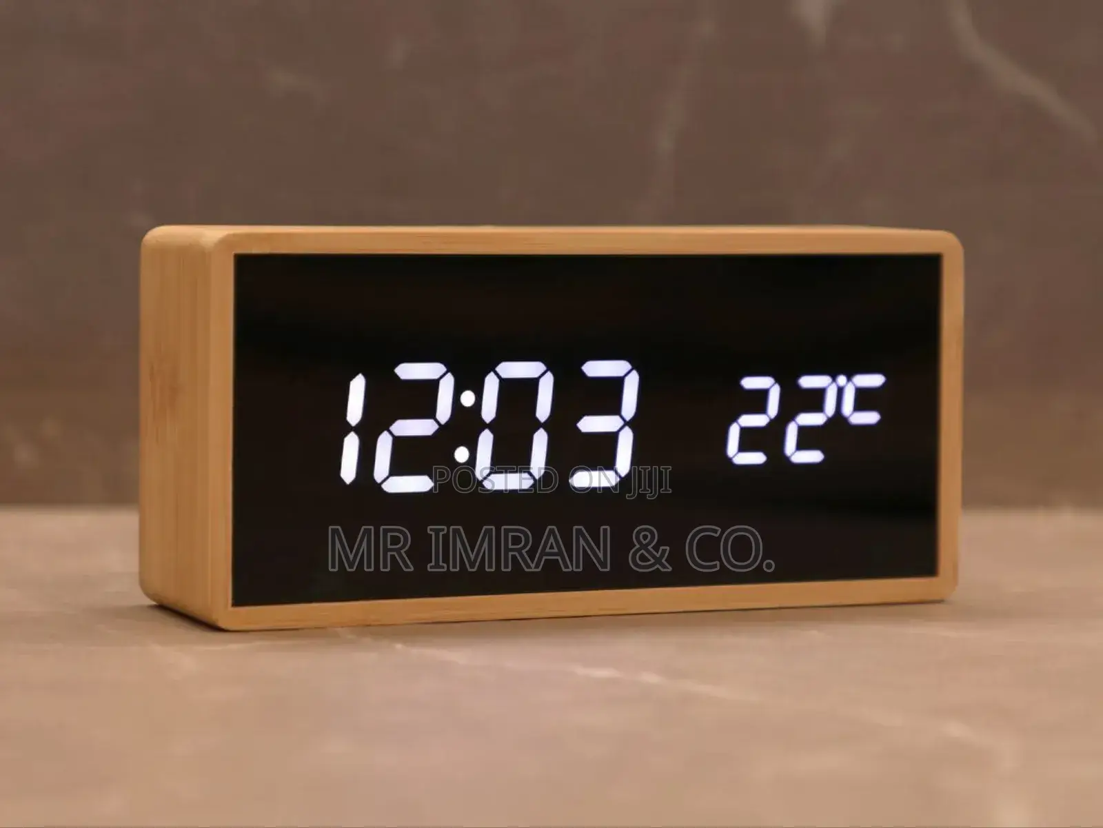 Modern Digital Alarm Clock With a Light Wood-Colored Casing