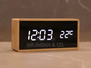 Modern Digital Alarm Clock With a Light Wood-Colored Casing