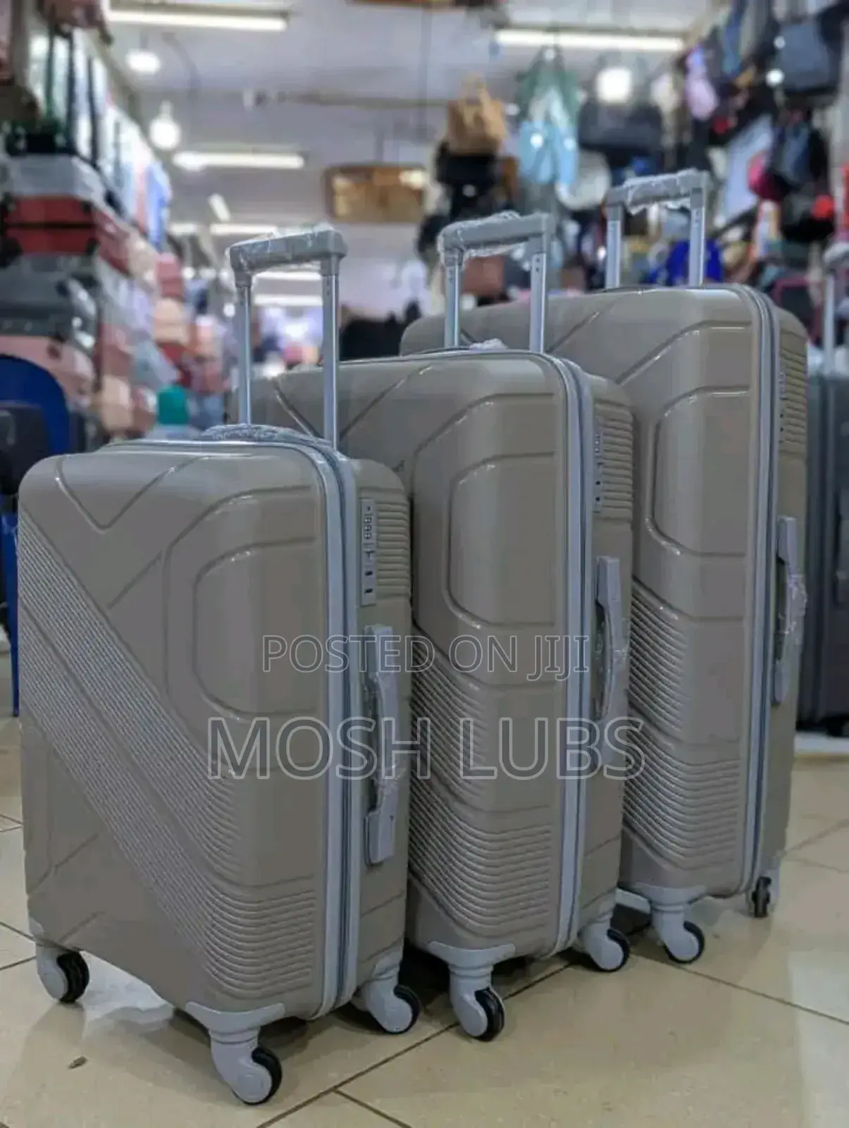 A Pack of 3 Plastic Travel Suitcases