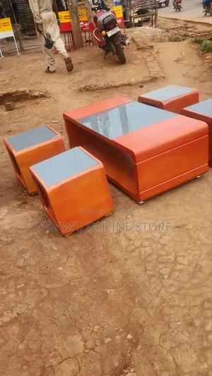 Brown Center Table With Grey Glass on Top