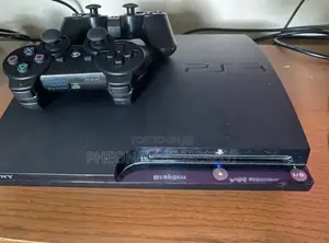 Playstation 3 Slim in a Mint Condition. Comes With 2 Pads and 15 Games
