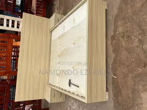 A Bed With Bedside Table and Mattress