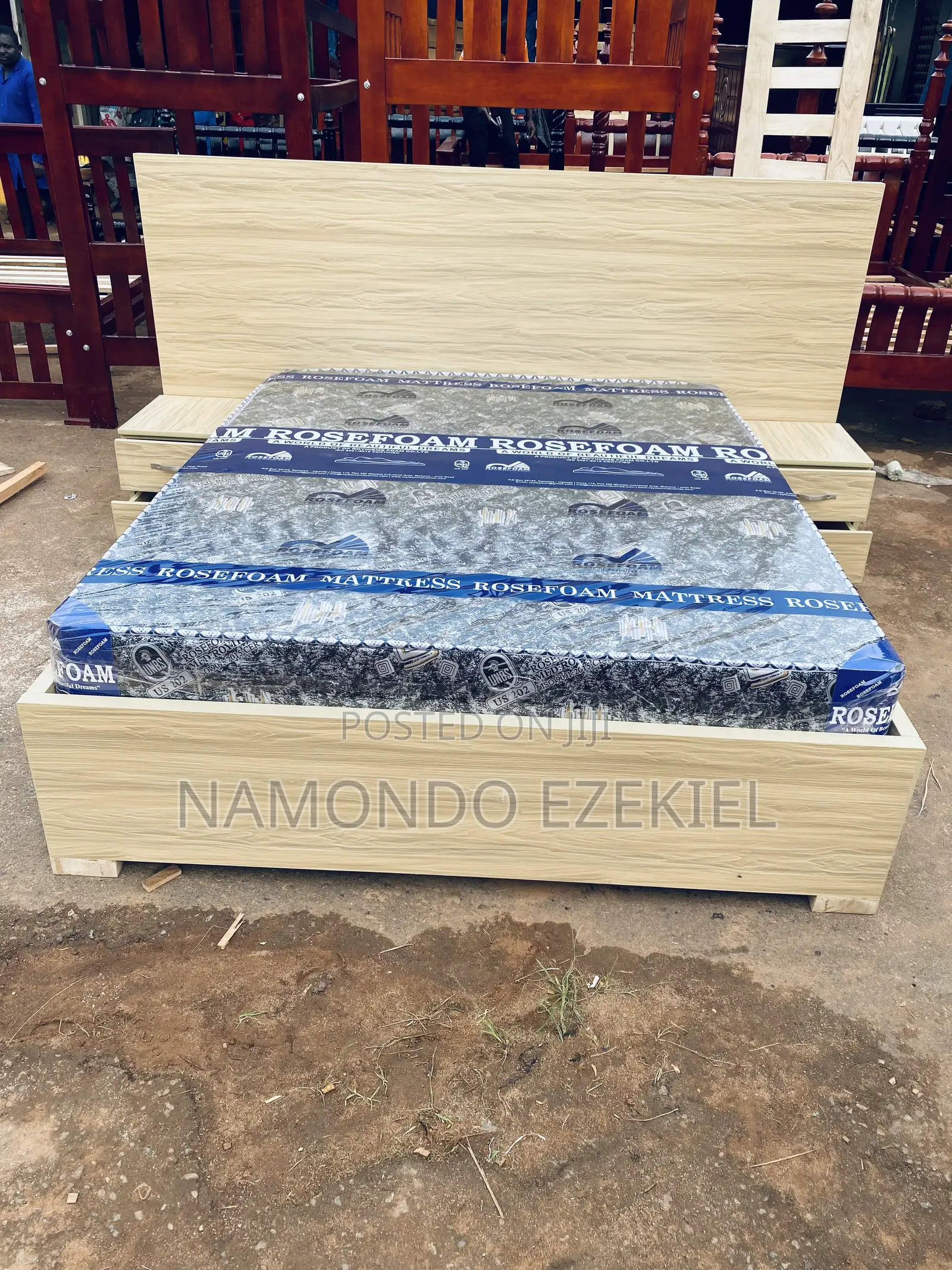 A Bed With Bedside Table and Mattress
