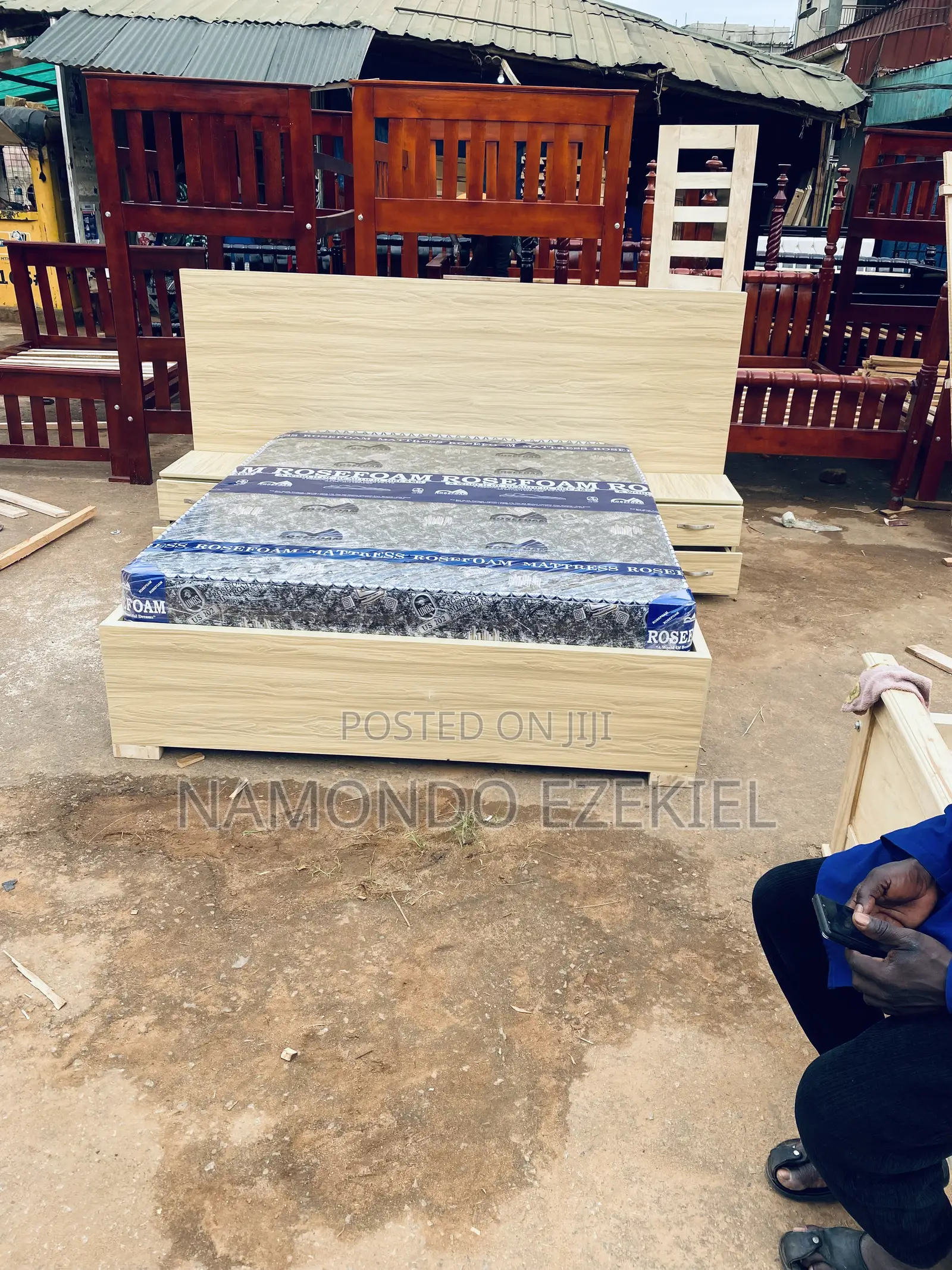 A Bed With Bedside Table and Mattress