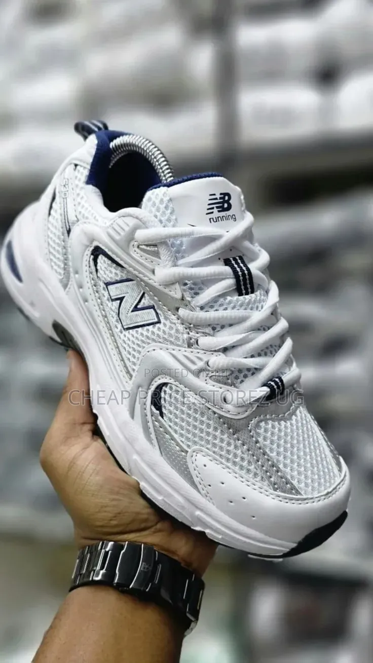 The Product Is a New Balance 530 Sneaker in White and Silver.
