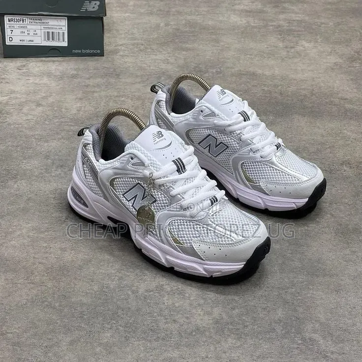 The Product Is a New Balance 530 Sneaker in White and Silver.