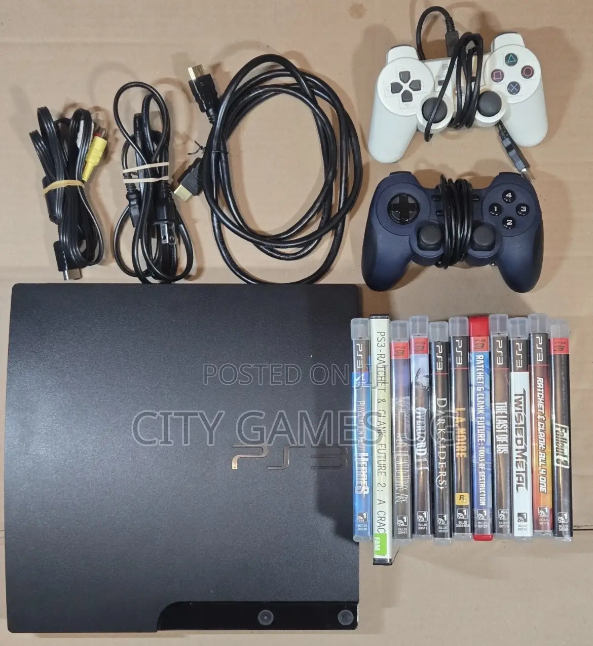 Playstation 3 Console, Cords, 2 Controllers, and 11 Games -