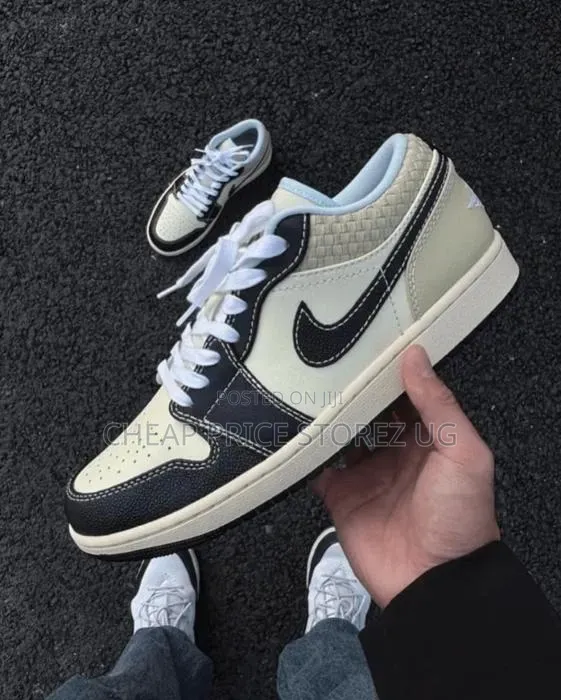 A Pair of Nike Air Jordan 1 Low Se Sneakers in "Coconut Milk Black