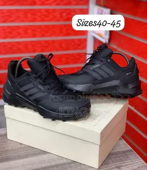 Black Adidas Terrex Ax4 Hiking Shoes.