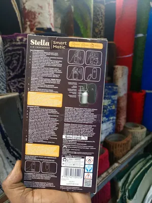 Stella Smart Matic Air Freshener With a Caffe Latte Scent Refill.