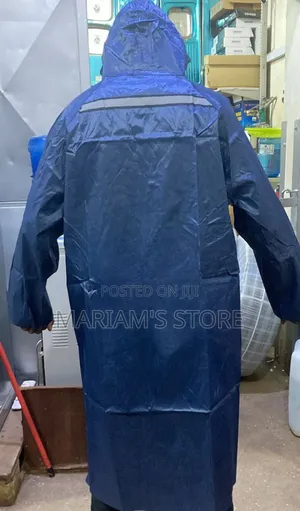 Navy Blue Unisex Rain Coat Featuring A Hood And A Reflective Safety.