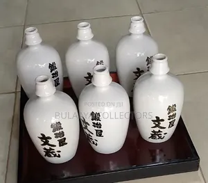Vintage Gekkeikan "Sake of the Samurai" White Ceramic Decor Bottles.