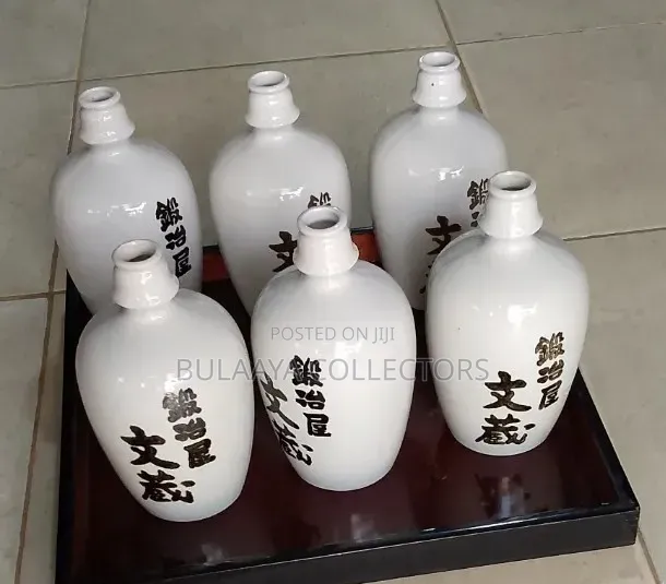 Vintage Gekkeikan "Sake of the Samurai" White Ceramic Decor Bottles.
