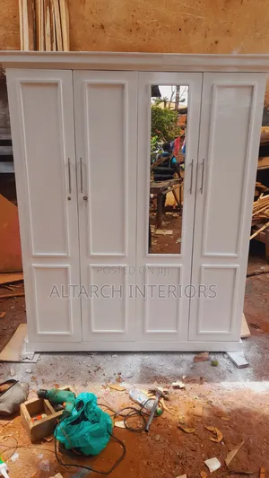 Well Finished Wardrobe in White and a Mirror