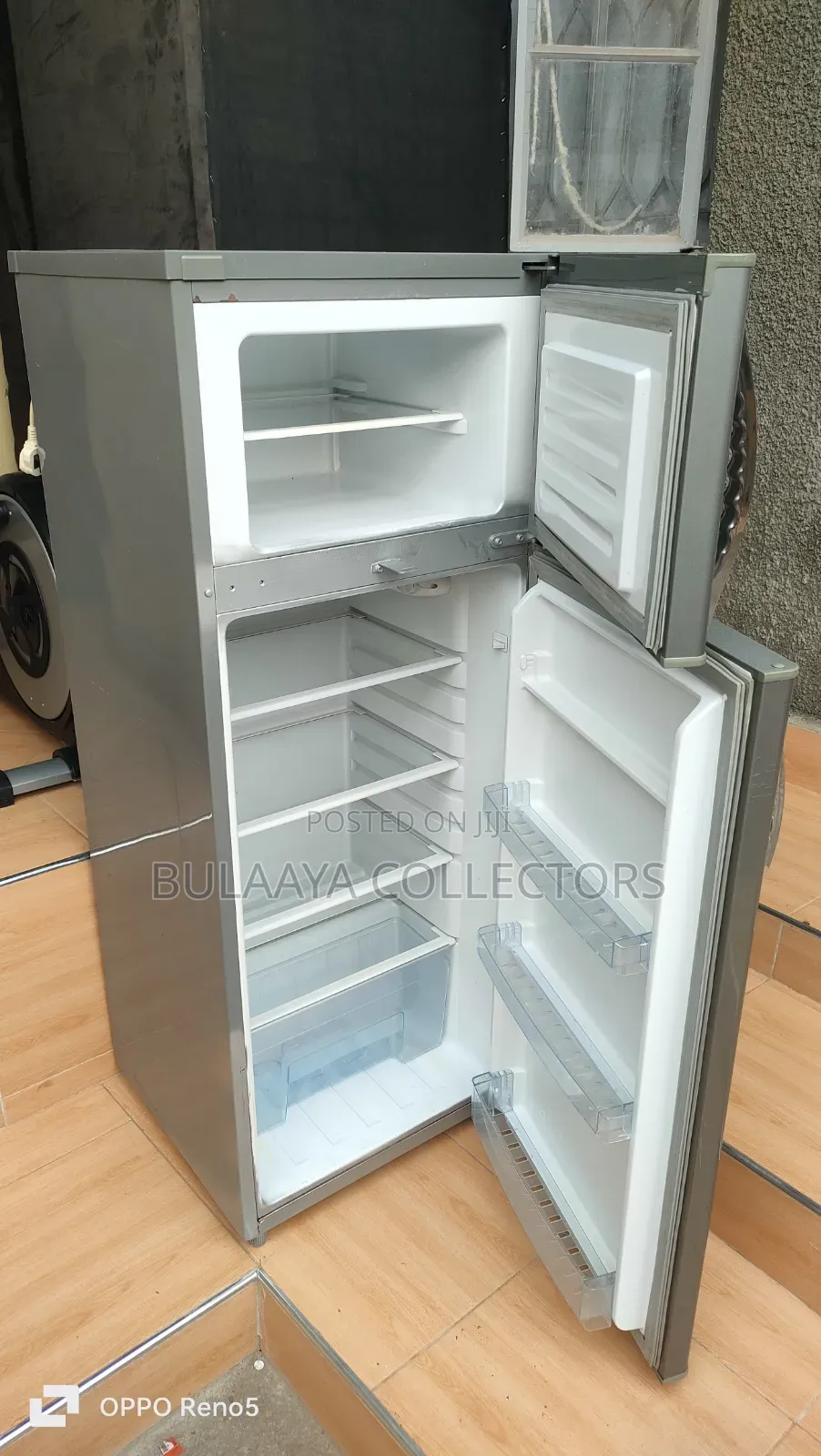 Mika Brand Silver Double-Door Top-Mount Refrigerator.