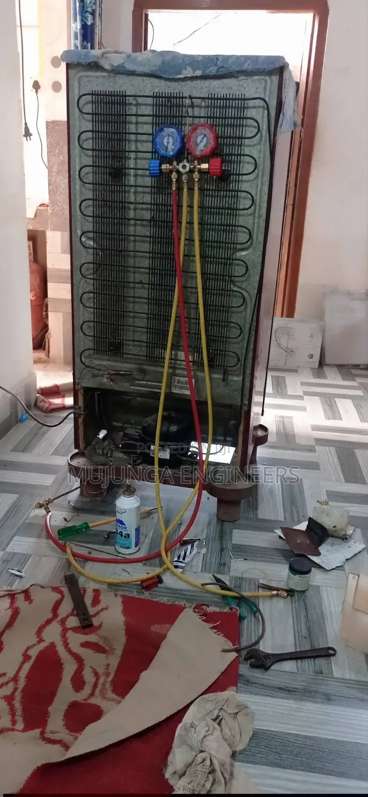 Fridge Gas Refill in Progress