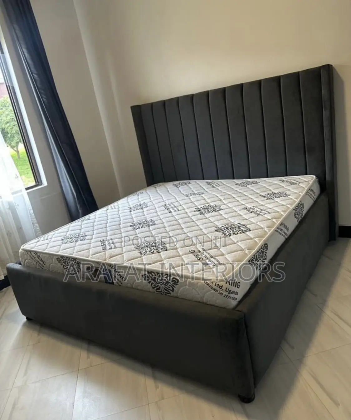 Grey Upholstered Bed With Vertical Padded Headboard