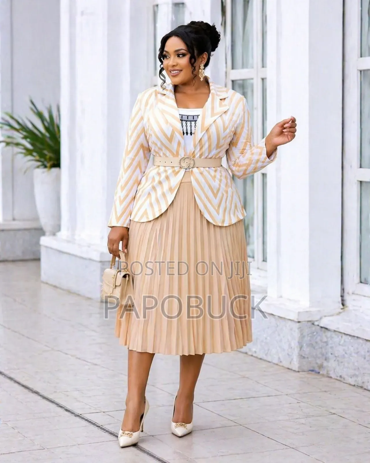 Women's Double-Breasted Blazer Paired With a Pleated Skirt
